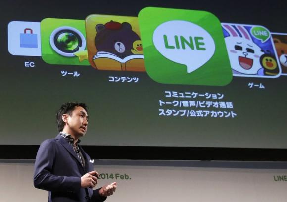 File photo of Takeshi Idezawa, chief operating officer of Line Corp, speaking during an announcement of its new service in Tokyo