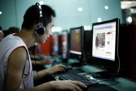 In this photo taken Tuesday, June 20, 2009, customers surf the Internet at an Internet cafe in Beijing, China. In a rare reversal, China's government gave in to domestic and international pressure and backed down from a rule that would have required personal computers sold in the country to have Internet-filtering software. Just hours before the rule was to have taken effect Wednesday, the government said it would postpone the requirement for the "Green Dam" software.  (AP Photo/Greg Baker)
